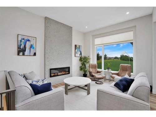 4 Cameron Court, Lacombe, AB - Indoor Photo Showing Living Room With Fireplace