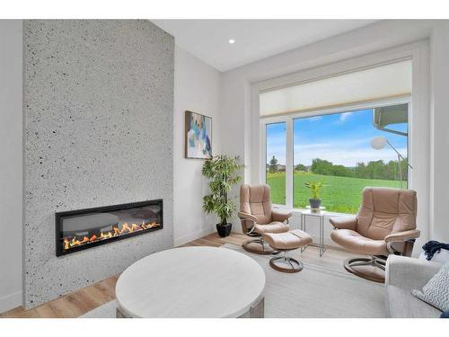 4 Cameron Court, Lacombe, AB - Indoor Photo Showing Living Room With Fireplace