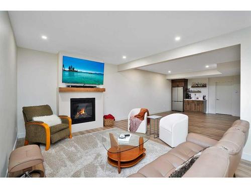 4 Cameron Court, Lacombe, AB - Indoor Photo Showing Living Room With Fireplace