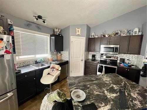 1225-31 Jamieson Avenue, Red Deer, AB - Indoor Photo Showing Kitchen With Stainless Steel Kitchen With Double Sink