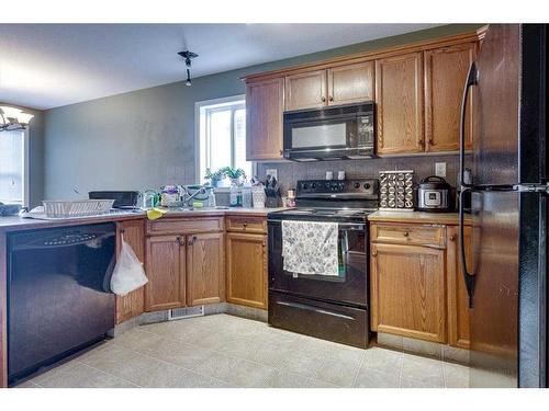 97 Inglewood Drive, Red Deer, AB - Indoor Photo Showing Kitchen With Double Sink