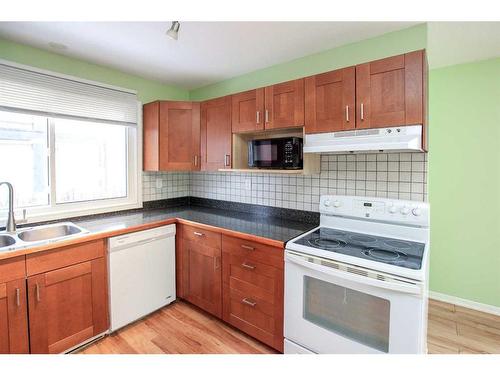 29 Abbott Close, Red Deer, AB - Indoor Photo Showing Kitchen With Double Sink