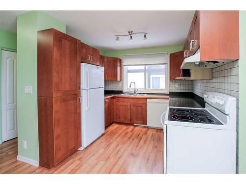 29 Abbott Close, Red Deer, AB - Indoor Photo Showing Kitchen With Double Sink