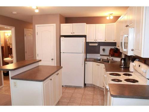 20 Arthur Close, Red Deer, AB - Indoor Photo Showing Kitchen With Double Sink