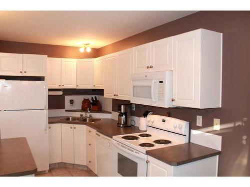 20 Arthur Close, Red Deer, AB - Indoor Photo Showing Kitchen With Double Sink