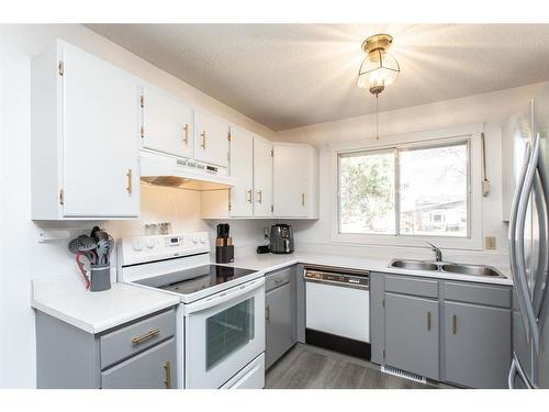 5741 44 Avenue, Lacombe, AB - Indoor Photo Showing Kitchen With Double Sink