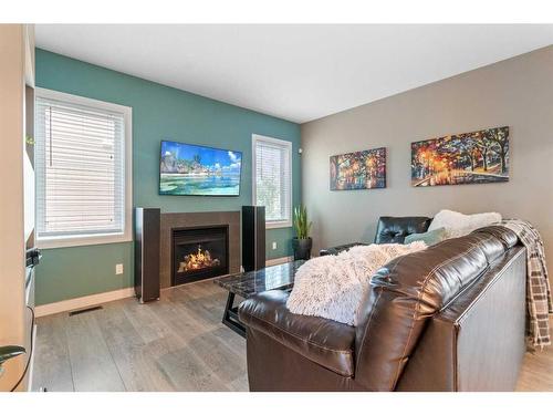 123 Morris Court, Blackfalds, AB - Indoor Photo Showing Living Room With Fireplace