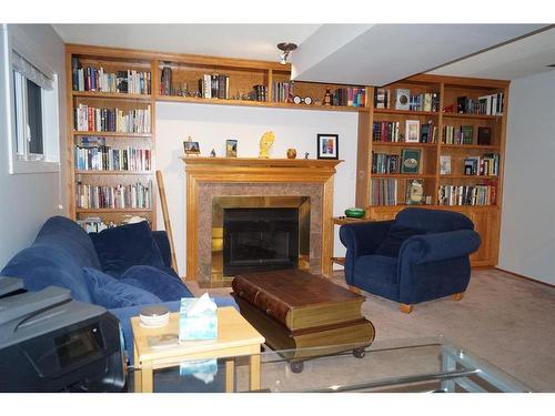 5503 63A Street Close, Ponoka, AB - Indoor Photo Showing Living Room With Fireplace