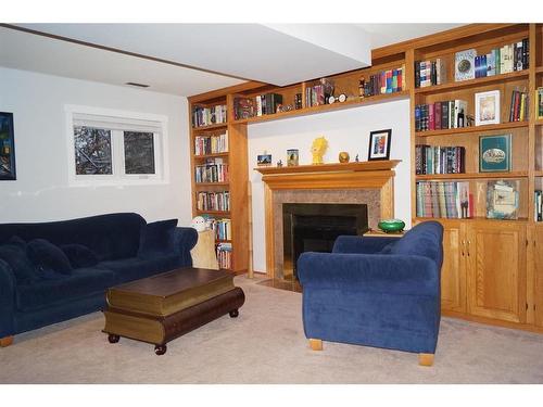 5503 63A Street Close, Ponoka, AB - Indoor Photo Showing Living Room With Fireplace