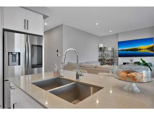 89 Memorial Parkway, Rural Red Deer County, AB - Indoor Photo Showing Kitchen With Double Sink