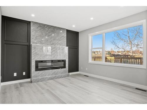 64 Sandringham Close Nw, Calgary, AB - Indoor Photo Showing Living Room With Fireplace