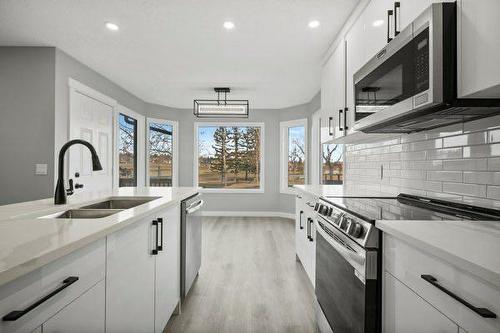 64 Sandringham Close Nw, Calgary, AB - Indoor Photo Showing Kitchen With Double Sink With Upgraded Kitchen