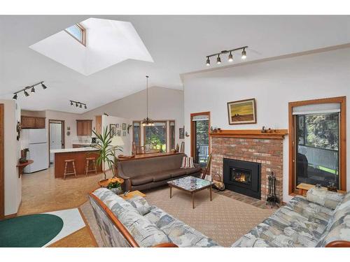 86-28319 Township Road 384, Rural Red Deer County, AB - Indoor Photo Showing Living Room With Fireplace