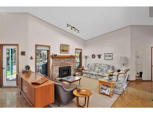 86-28319 Township Road 384, Rural Red Deer County, AB - Indoor Photo Showing Living Room With Fireplace