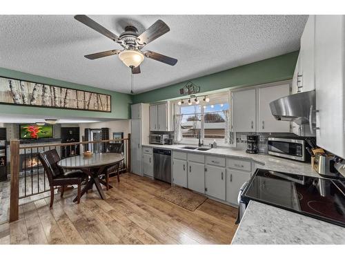 3813 67 St Street, Camrose, AB - Indoor Photo Showing Living Room With Fireplace