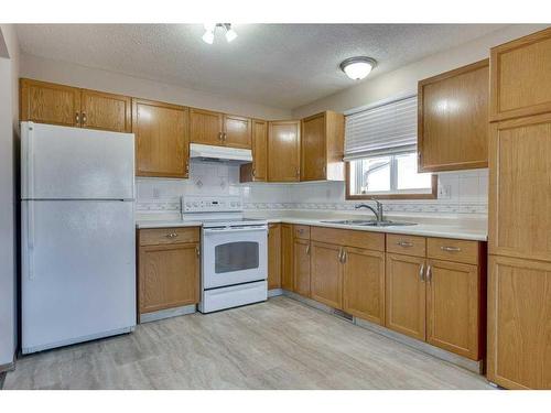 109 Eastman Crescent, Red Deer, AB - Indoor Photo Showing Kitchen With Double Sink