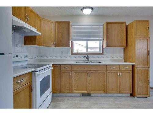 109 Eastman Crescent, Red Deer, AB - Indoor Photo Showing Kitchen With Double Sink