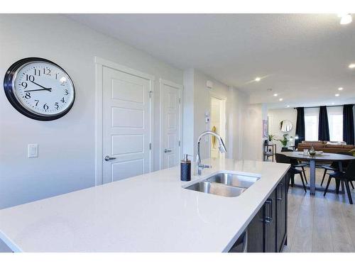 106-40 Livingston Parade Ne, Calgary, AB - Indoor Photo Showing Kitchen With Double Sink