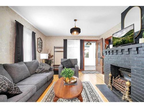 5037 48 Street, Sylvan Lake, AB - Indoor Photo Showing Living Room With Fireplace