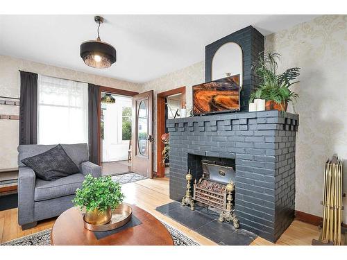 5037 48 Street, Sylvan Lake, AB - Indoor Photo Showing Living Room With Fireplace