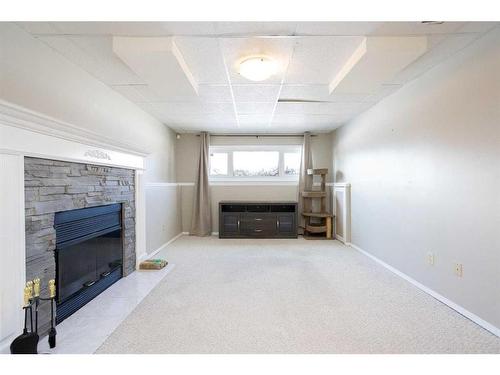 12 Richards Close, Red Deer, AB - Indoor With Fireplace