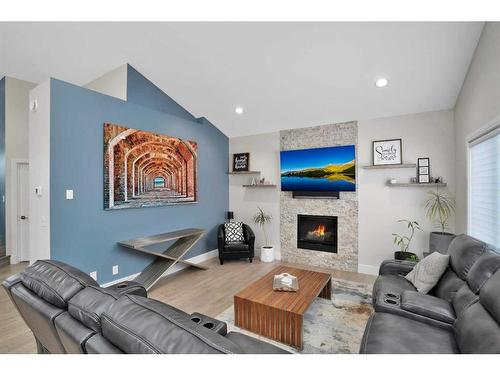 110 Lalor Drive, Red Deer, AB - Indoor Photo Showing Living Room With Fireplace