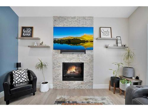 110 Lalor Drive, Red Deer, AB - Indoor Photo Showing Living Room With Fireplace