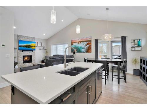 110 Lalor Drive, Red Deer, AB - Indoor Photo Showing Kitchen With Fireplace With Double Sink