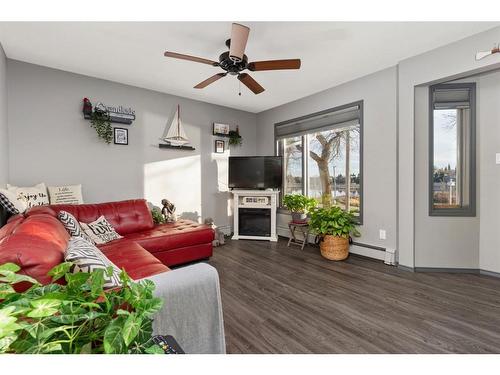 B-4821 54 Street, Camrose, AB - Indoor Photo Showing Living Room With Fireplace