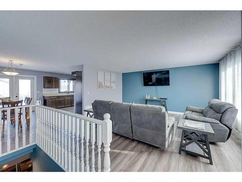 4702 52 Avenue, Clive, AB - Indoor Photo Showing Living Room