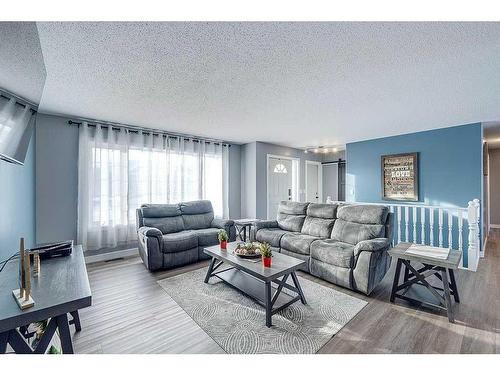 4702 52 Avenue, Clive, AB - Indoor Photo Showing Living Room