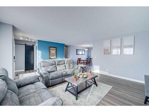 4702 52 Avenue, Clive, AB - Indoor Photo Showing Living Room