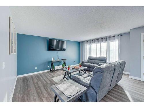 4702 52 Avenue, Clive, AB - Indoor Photo Showing Living Room