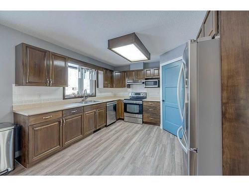 4702 52 Avenue, Clive, AB - Indoor Photo Showing Kitchen With Double Sink