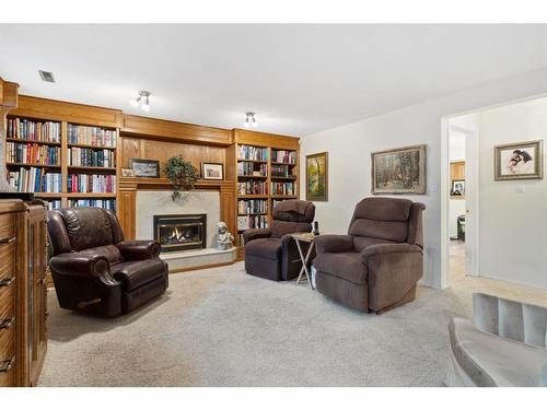 106 Abbey Street, Bittern Lake, AB - Indoor Photo Showing Living Room With Fireplace