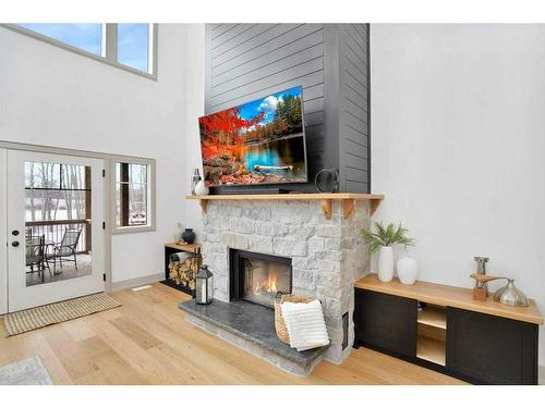 4-13033 424 Township, Rural Ponoka County, AB - Indoor Photo Showing Living Room With Fireplace