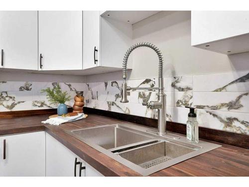 58 Lakeview Crescent, Sylvan Lake, AB - Indoor Photo Showing Kitchen With Double Sink