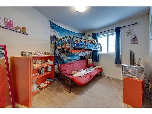 51 Lodge Place, Sylvan Lake, AB - Indoor Photo Showing Bedroom