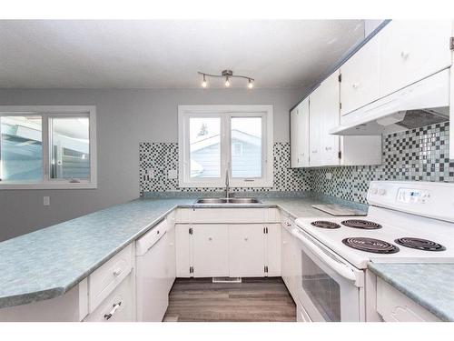 35 Barner Avenue, Red Deer, AB - Indoor Photo Showing Kitchen With Double Sink