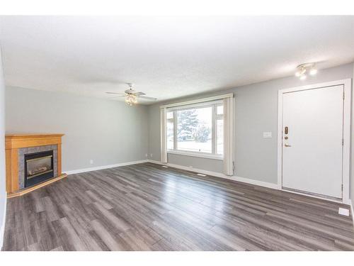 35 Barner Avenue, Red Deer, AB - Indoor Photo Showing Other Room With Fireplace