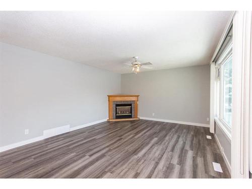 35 Barner Avenue, Red Deer, AB - Indoor Photo Showing Other Room With Fireplace