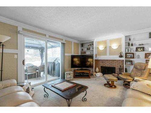 560 Wahstao Road Nw, Edmonton, AB - Indoor Photo Showing Living Room With Fireplace