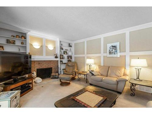 560 Wahstao Road Nw, Edmonton, AB - Indoor Photo Showing Living Room With Fireplace