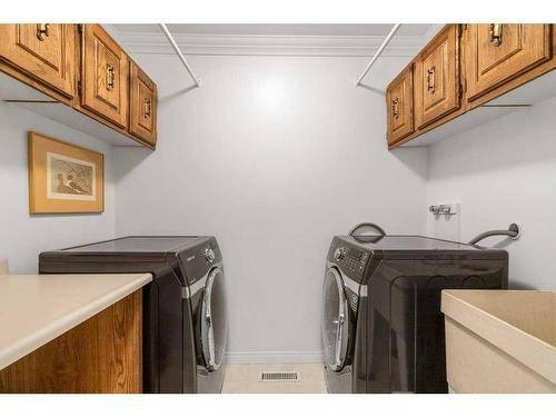 560 Wahstao Road Nw, Edmonton, AB - Indoor Photo Showing Laundry Room