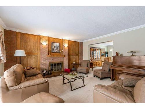 560 Wahstao Road Nw, Edmonton, AB - Indoor Photo Showing Living Room With Fireplace