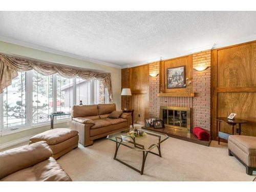 560 Wahstao Road Nw, Edmonton, AB - Indoor Photo Showing Living Room With Fireplace