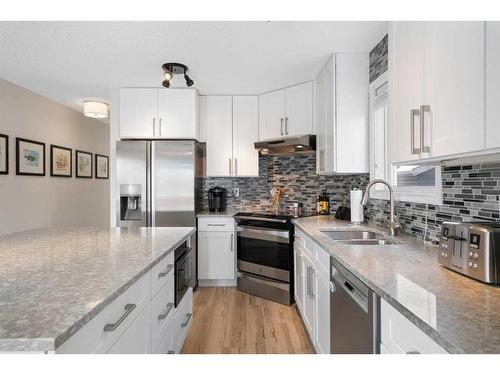 16117 Shawbrooke Road Sw, Calgary, AB - Indoor Photo Showing Kitchen With Double Sink With Upgraded Kitchen