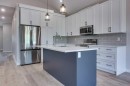 117 Gray Close, Sylvan Lake, AB  - Indoor Photo Showing Kitchen With Stainless Steel Kitchen With Upgraded Kitchen 