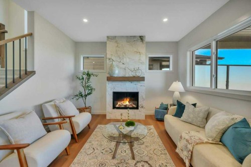 7 Vincent Gate, Sylvan Lake, AB - Indoor Photo Showing Living Room With Fireplace