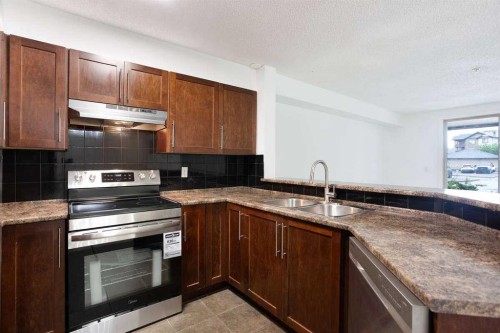 3105-60 Panatella Street Nw, Calgary, AB - Indoor Photo Showing Kitchen With Double Sink